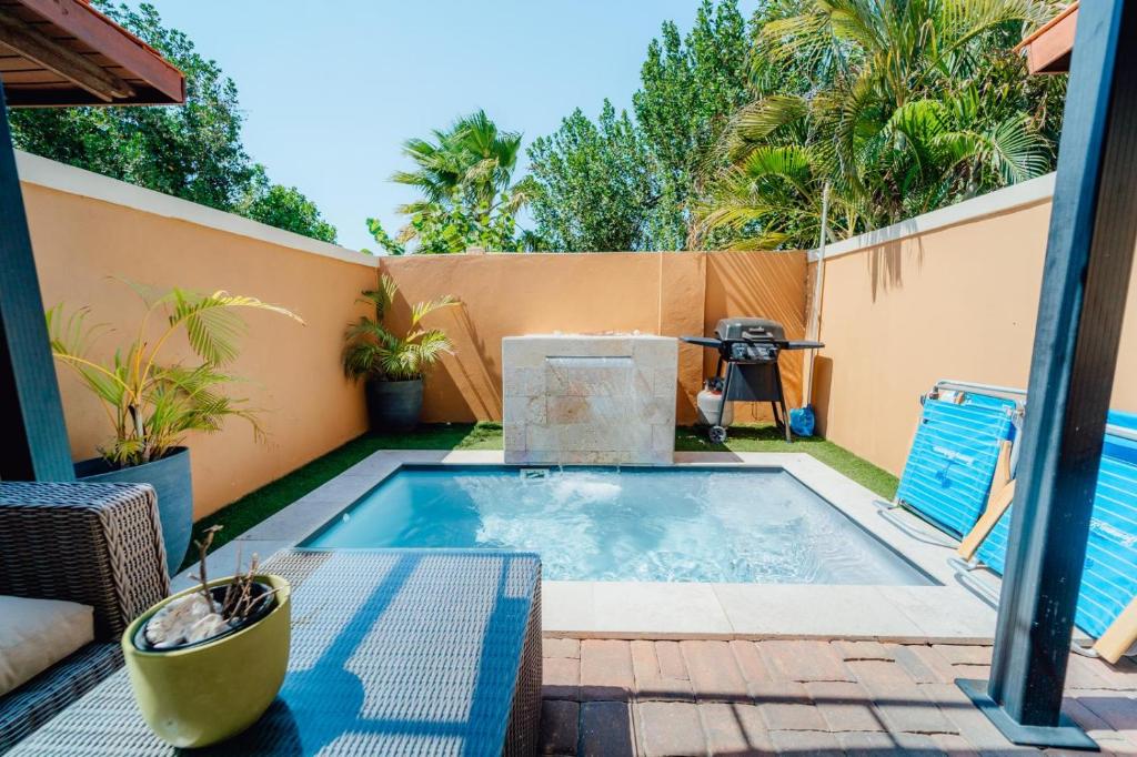 a small swimming pool in the backyard of a house at Gold coast beautiful house with private pool in Palm-Eagle Beach