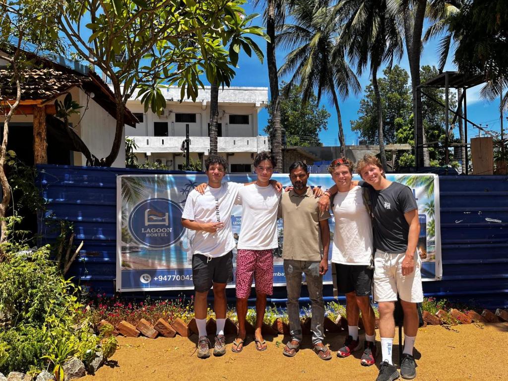 a group of people posing for a picture at Lagoon Hostel in Arugam Bay