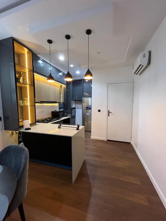 a kitchen with a large island in a room at Pcg Homes in Lagos