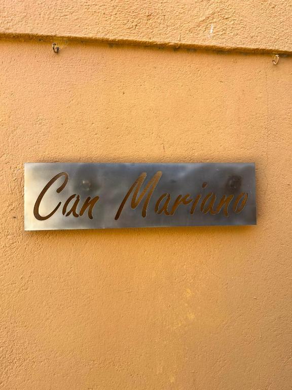 a sign on a wall that says car marotta at Can Mariano in Mollet de Perelada