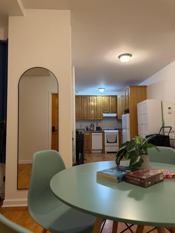 a kitchen and dining room with a table and chairs at The atlas - Shared apartment in New York