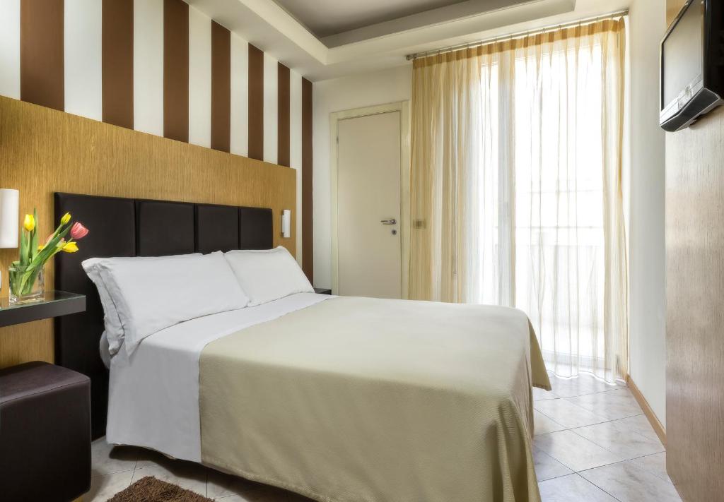 Postel nebo postele na pokoji v ubytování ACasaMia WelcHome Hotel