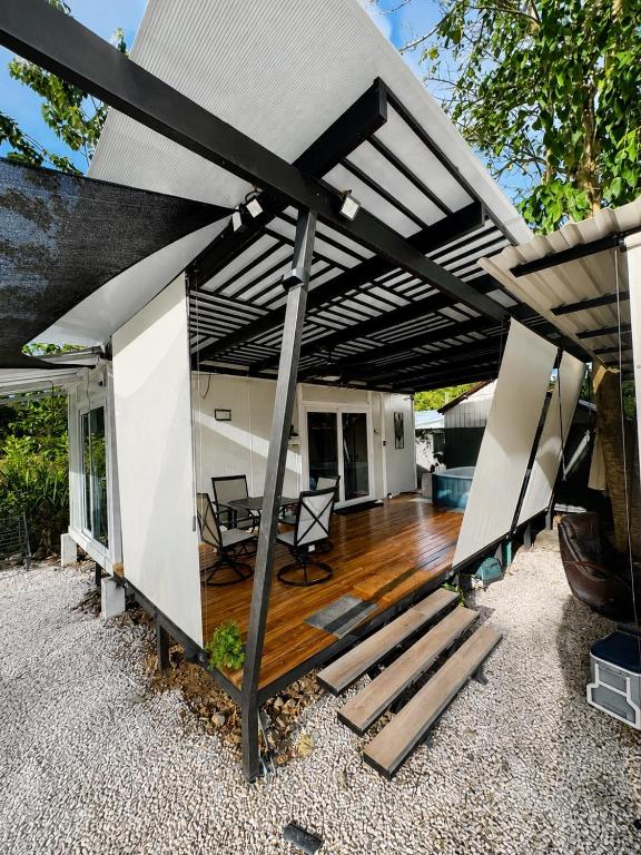 an open patio with awning on a house at Villa Horizonte in Plazuela