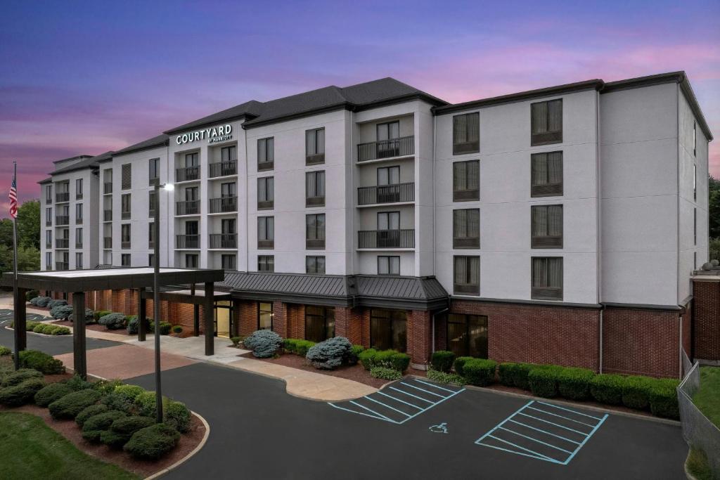 a rendering of the exterior of a hotel at Courtyard by Marriott Bloomington in Bloomington