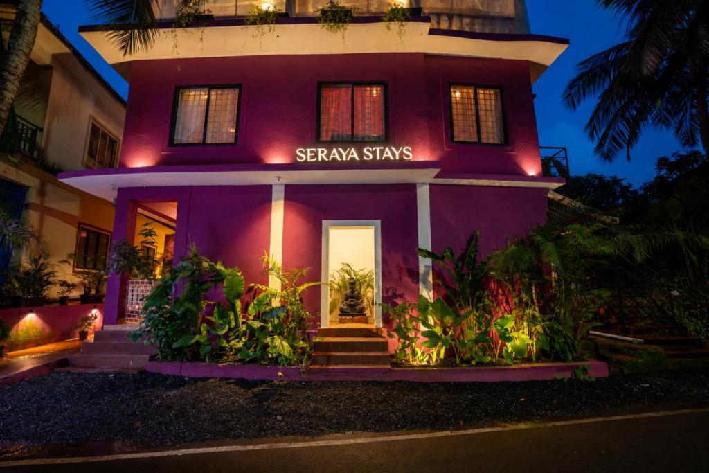a purple house with a sign that says steamships at Seraya Stays in Mandrem