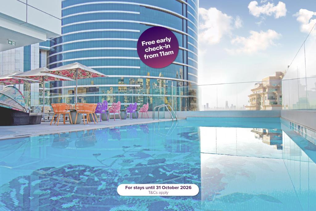 a rendering of a swimming pool in a building at Premier Inn Dubai Barsha Heights in Dubai