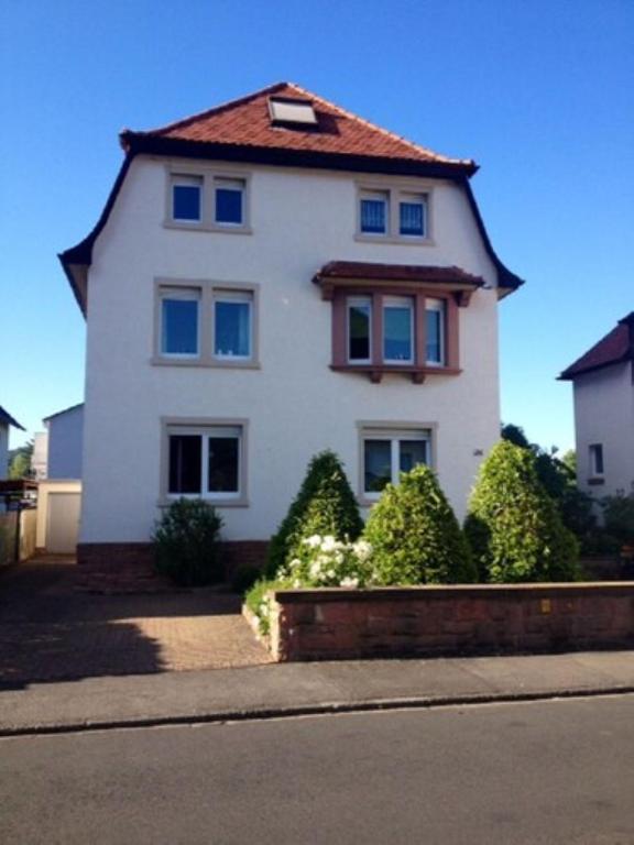 a large white house with a red roof at Ferienwohnung Anke Kaufmann in Miltenberg