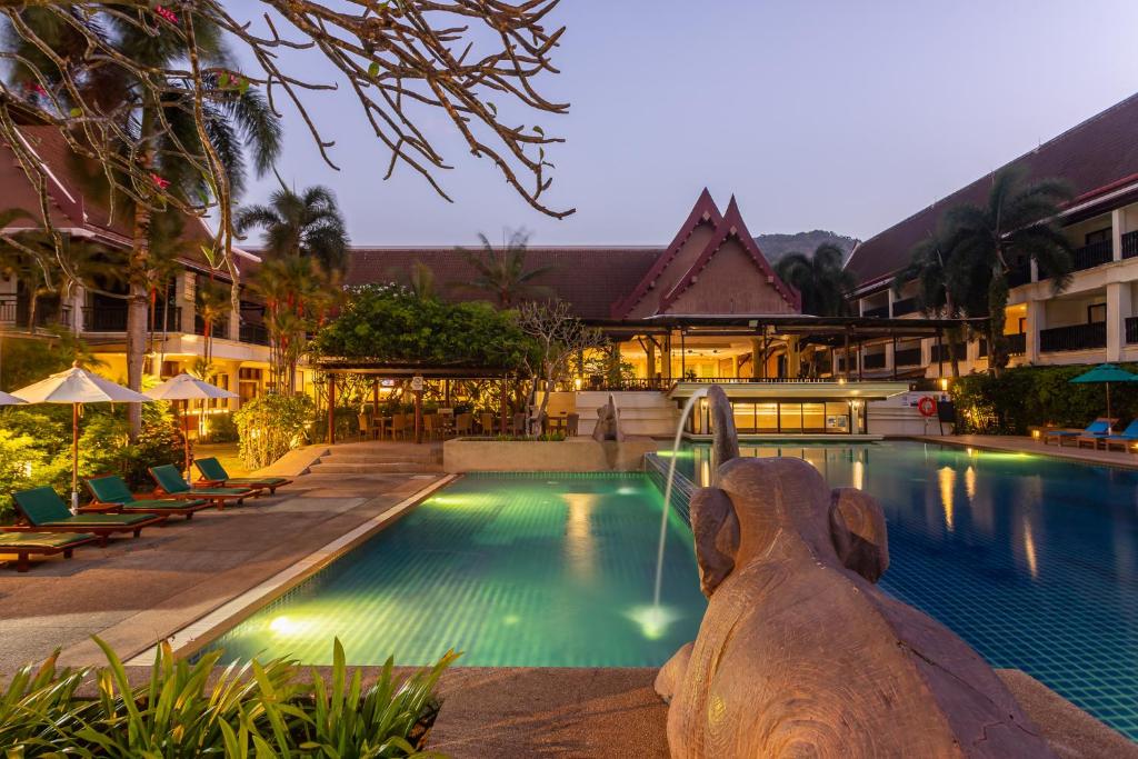a swimming pool in front of a hotel at Deevana Patong Resort & Spa in Patong Beach