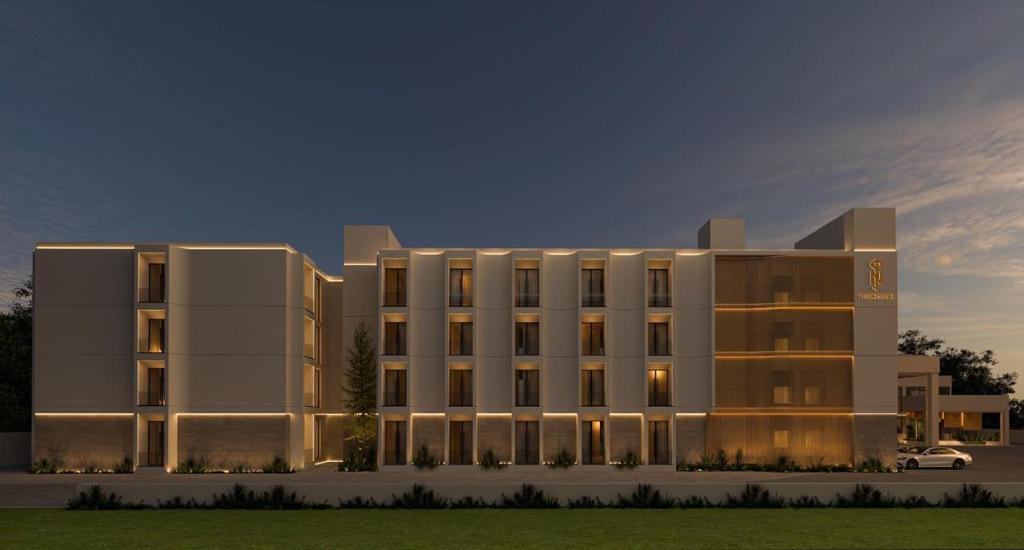 a rendering of a building with a car in front at The Nishat Hotel Margala in Islamabad