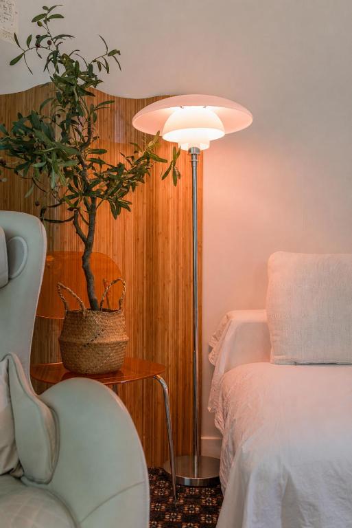 a bedroom with a potted plant next to a bed at 수지의 하우스 in Cheonan