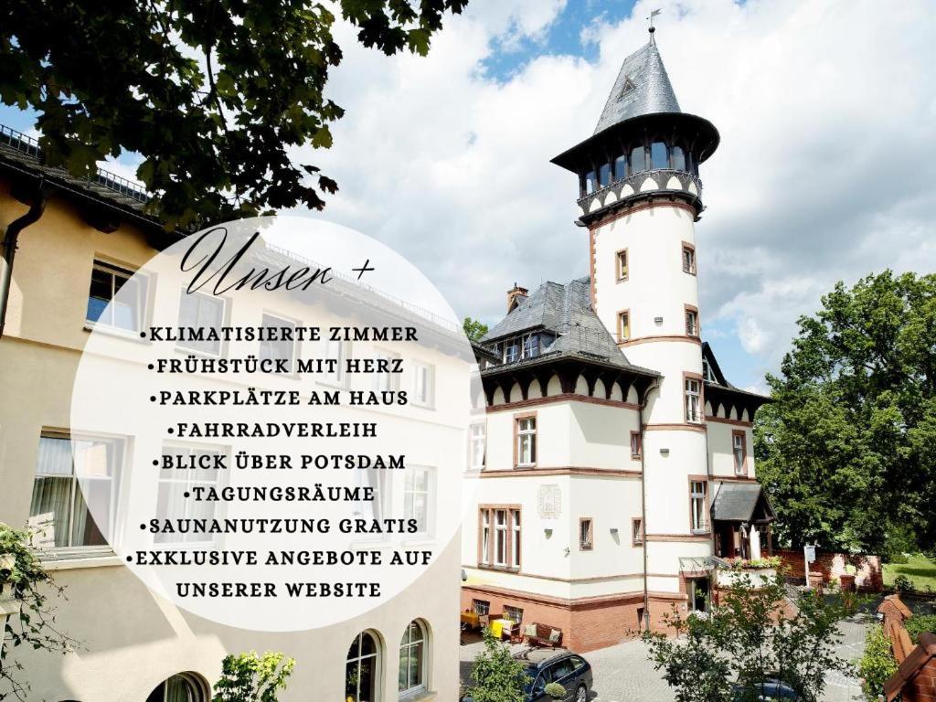 a castle with a sign in front of it at Hotel Villa Monte Vino in Potsdam