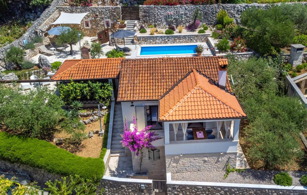 an overhead view of a house with an orange roof at Holiday House - Old Olive in Porozina
