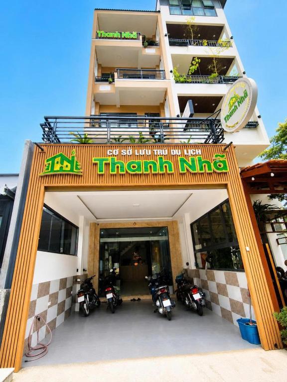 a building with motorcycles parked in front of it at Thanh Nhã House in Da Lat