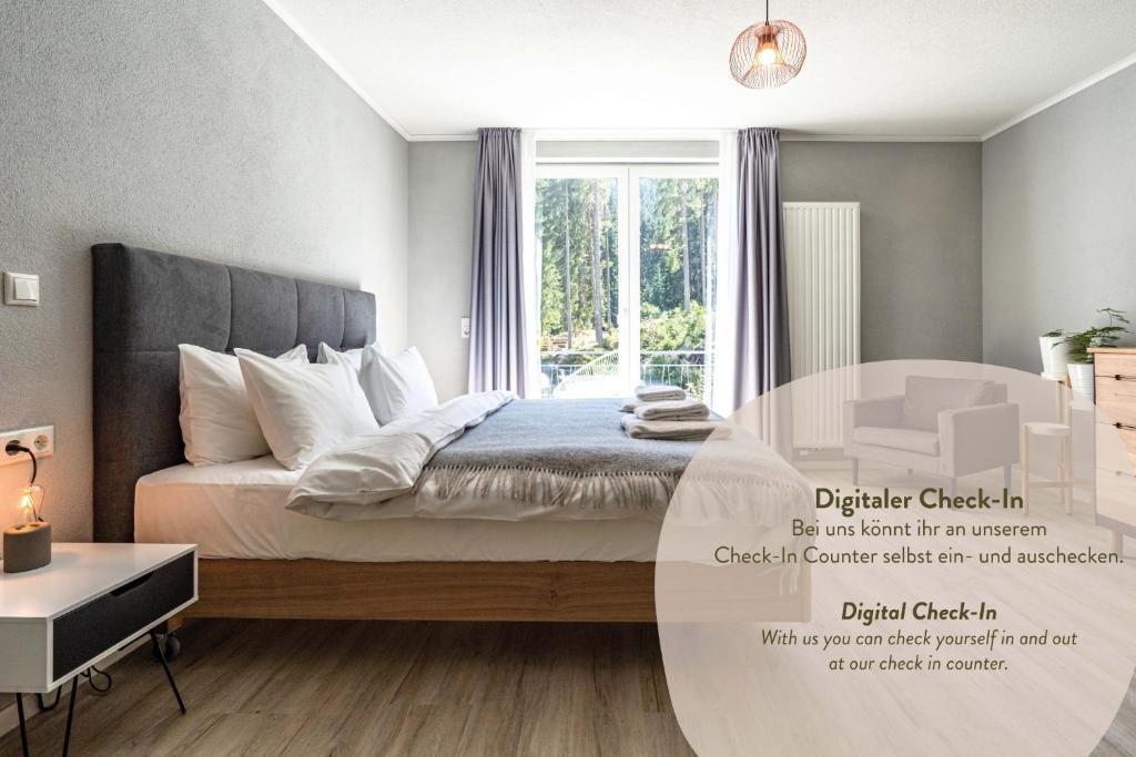 a bedroom with a bed with a glass table at stuub langenbach in Titisee-Neustadt