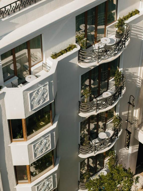 an overhead view of an apartment building with balconies at The Newel Kolonaki in Athens