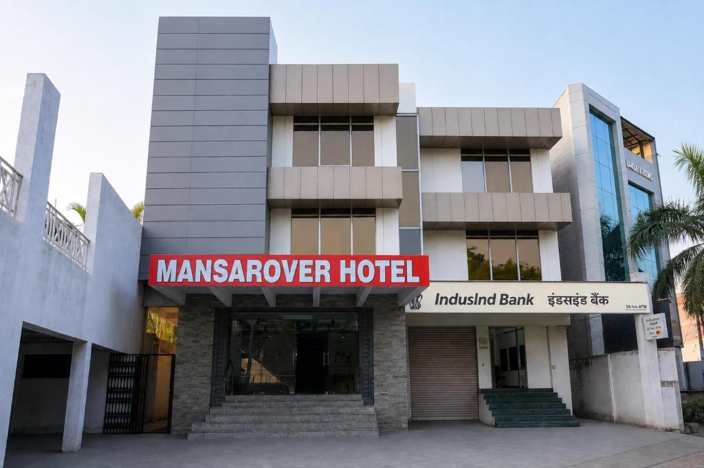 a building with a manasarovar hotel in front of it at Mansarover Hotel & Banquets in Bareilly