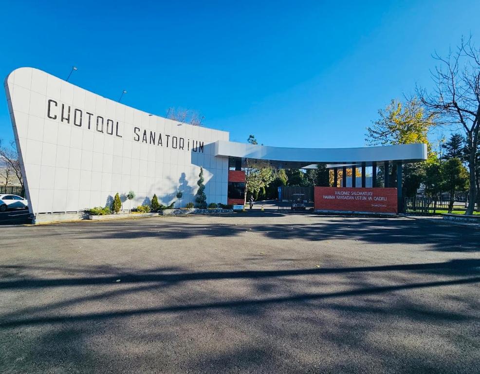 a building with a sign that reads church santa cruz at Chotqol Sanatorium in G‘azalkent