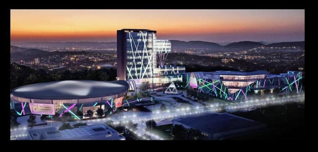 a rendering of a building with lights on it at Place At Menlyn in Pretoria