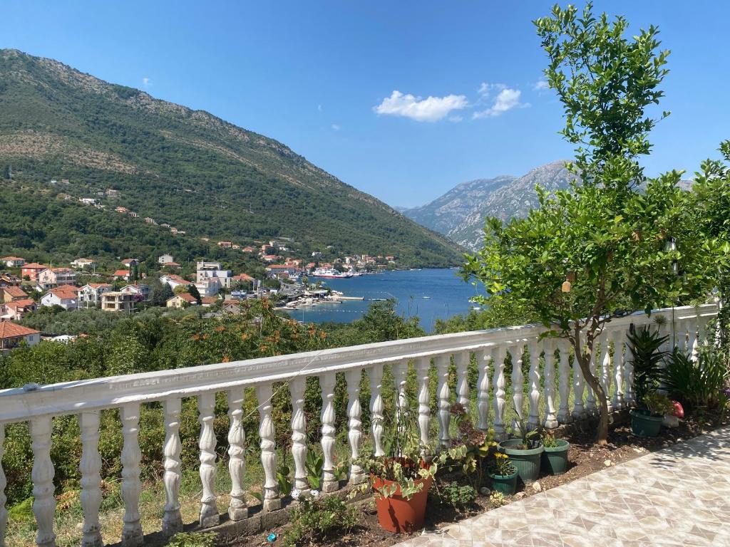 a white fence with a view of a lake at VERIGE VIEW Kamenari in Donja Jošica