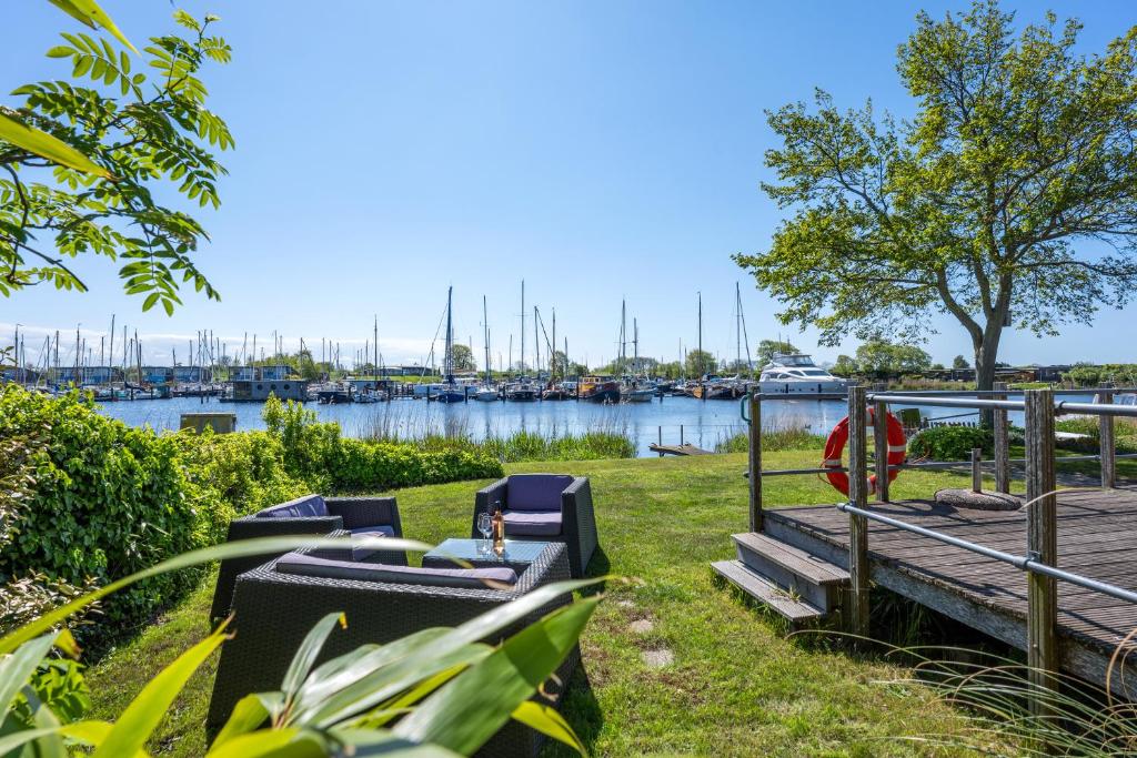 a view of a marina with boats in the water at Luwte aan het Lauwersmeer, Friesland in Anjum