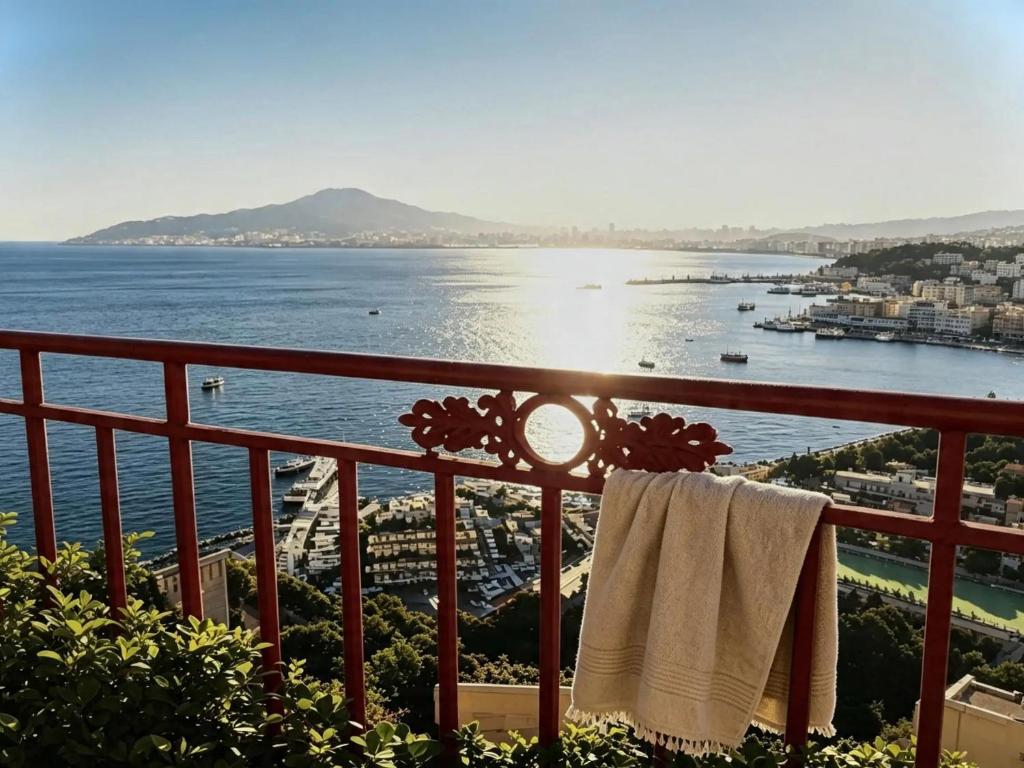 a view of the ocean from a balcony with towels at Maison La Torretta in Vico Equense