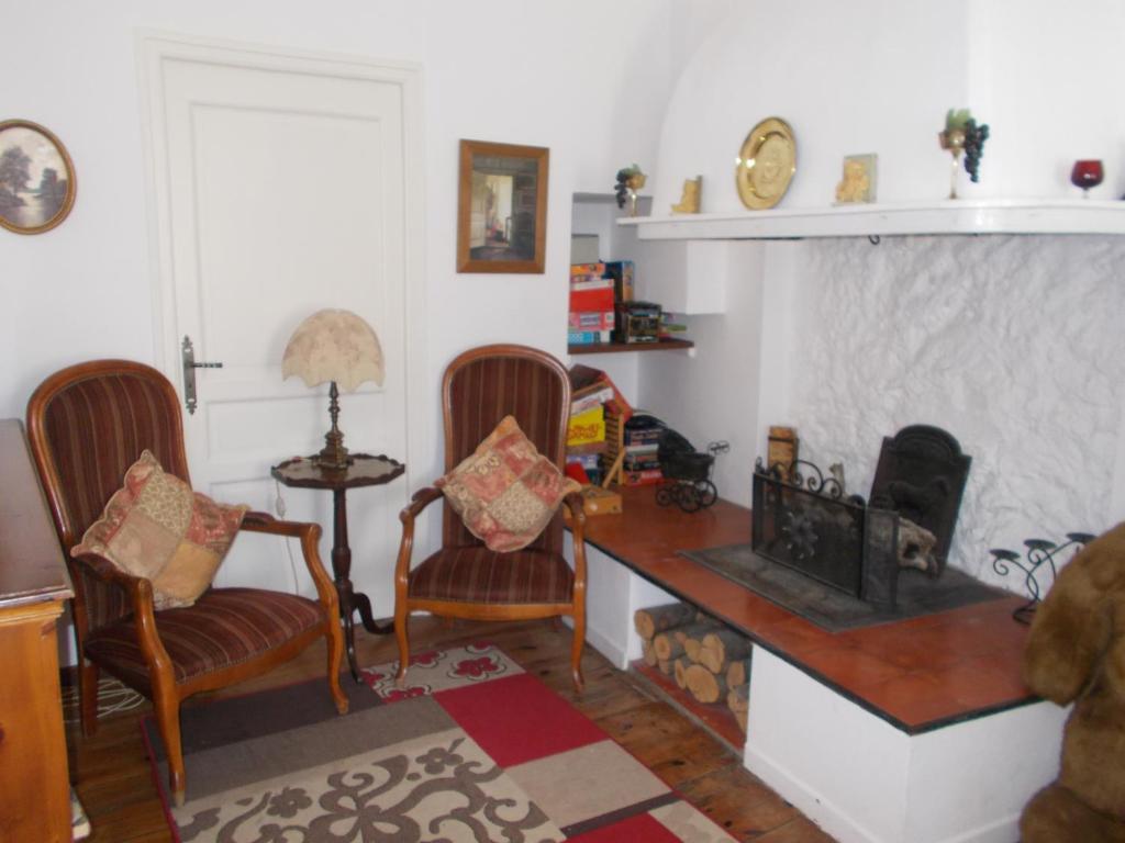Uma área de estar em Poppys Chambres d'Hotes