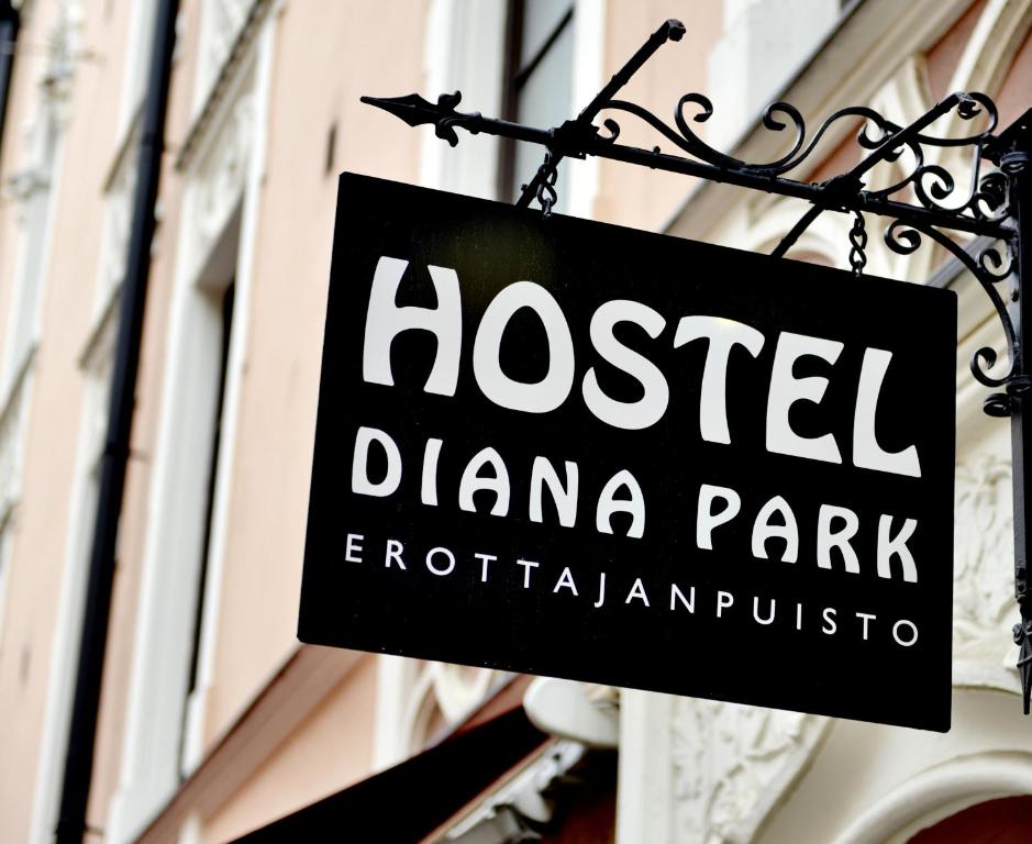 
a sign on a building at Hostel Diana Park in Helsinki
