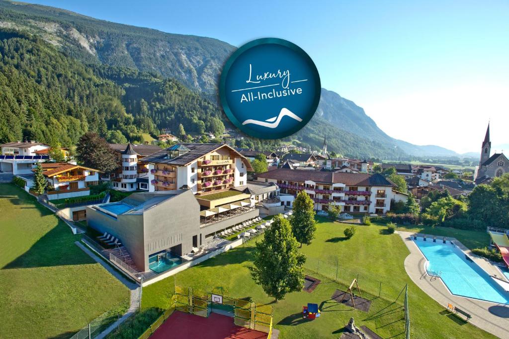 an image of a resort with the luxury alliance logo at Luxury All Inclusive Resort Schwarzbrunn - 4 Stars Superior in Stans