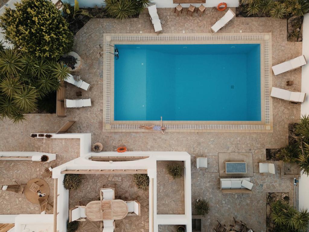 an overhead view of a swimming pool in a resort at Villa Kyma in Aegina