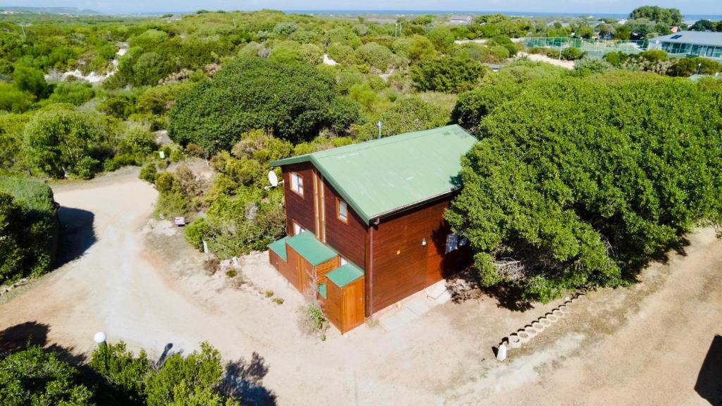 an overhead view of a house with a green roof at The Fisherman's LAB Cabin in Hermanus