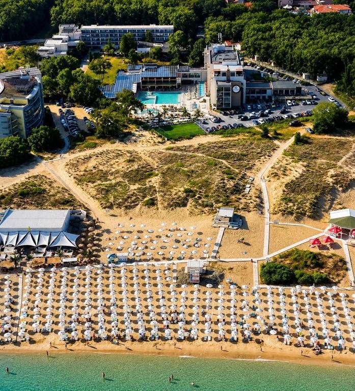 an aerial view of a beach with a parking lot at Hotel Palms Beach Kiten in Kiten