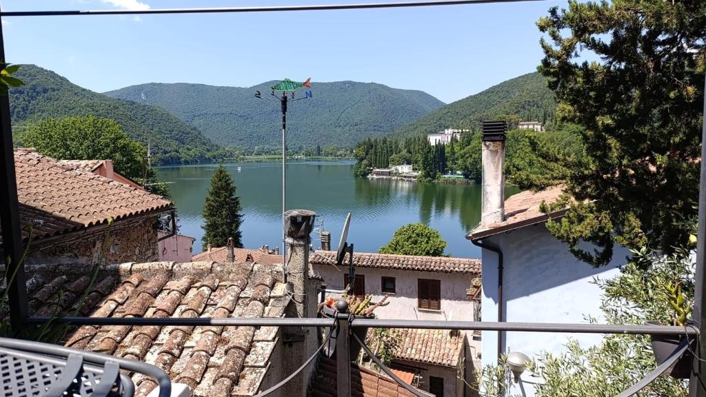 a view of a lake from the roofs of buildings at Il Nido nel Borgo in Piediluco