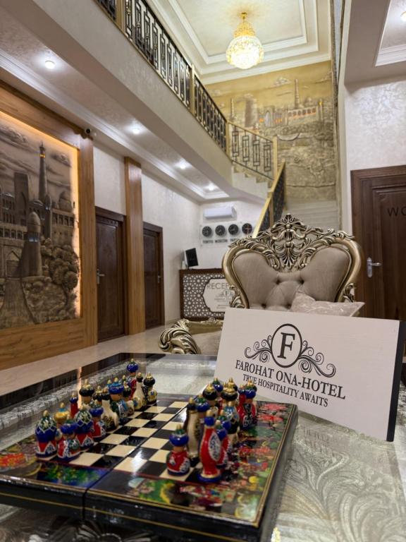 a hotel room with a chess board on a table at Hotel FAROHAT ONA in Khiva
