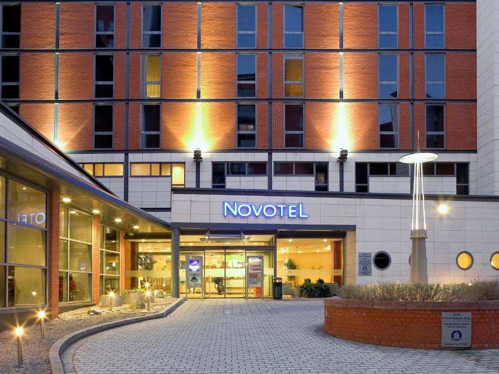 a building with a novation sign in front of it at Novotel Leeds Centre in Leeds