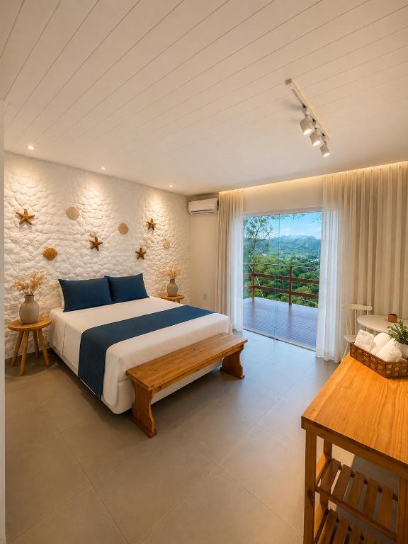 a bedroom with a large bed and a large window at Shalon Adonai by Martinelli Lodge in Fernando de Noronha