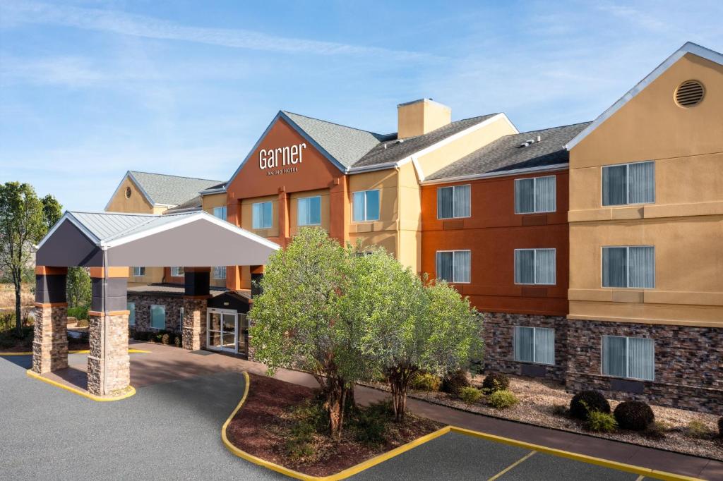 a rendering of a hotel with a parking lot at Garner Hotel Macon West by IHG in Macon