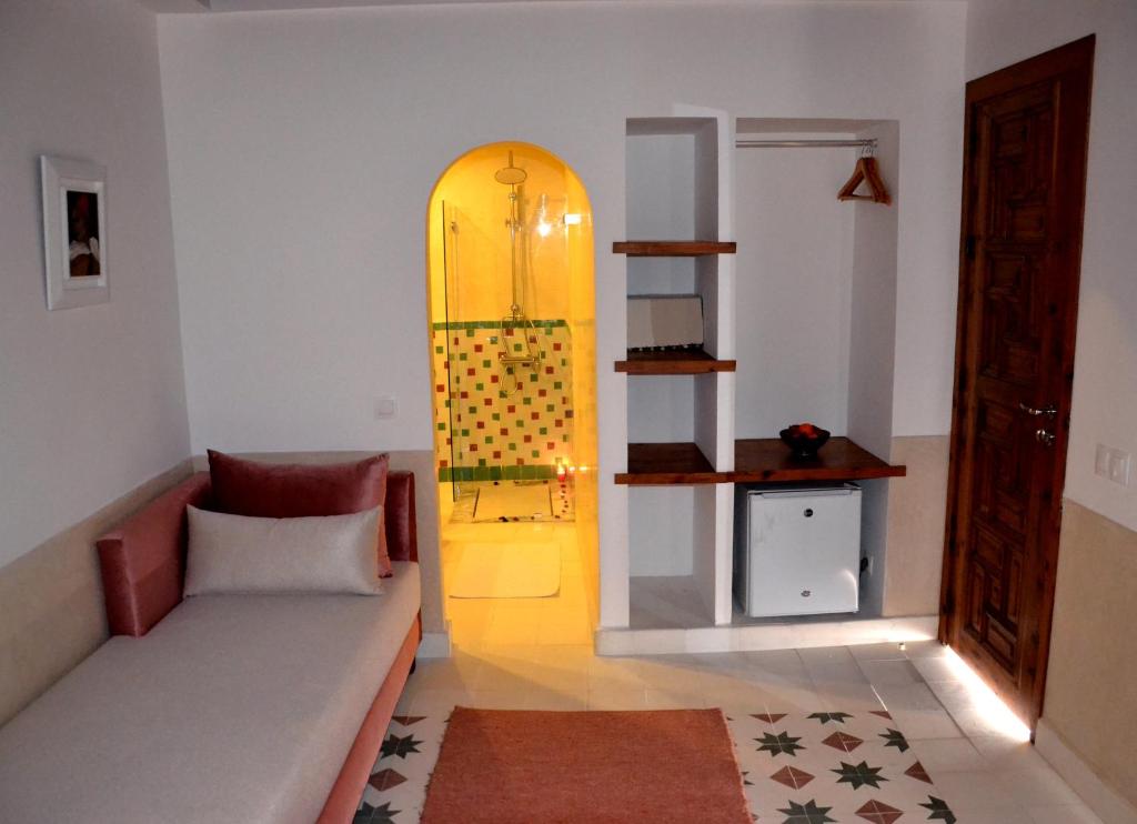 Postel nebo postele na pokoji v ubytování Riad Dar Dar