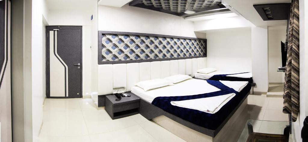 Un pat sau paturi într-o cameră la Hotel Fantacee