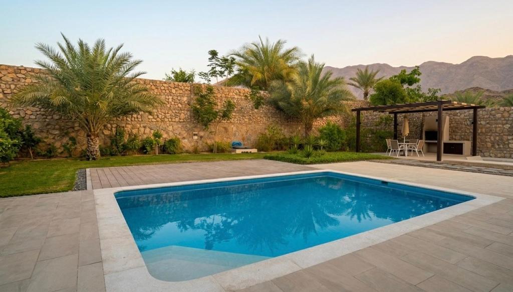 a swimming pool in the backyard of a house at Valley Farmhouse By Bait Zain in As Sīfah