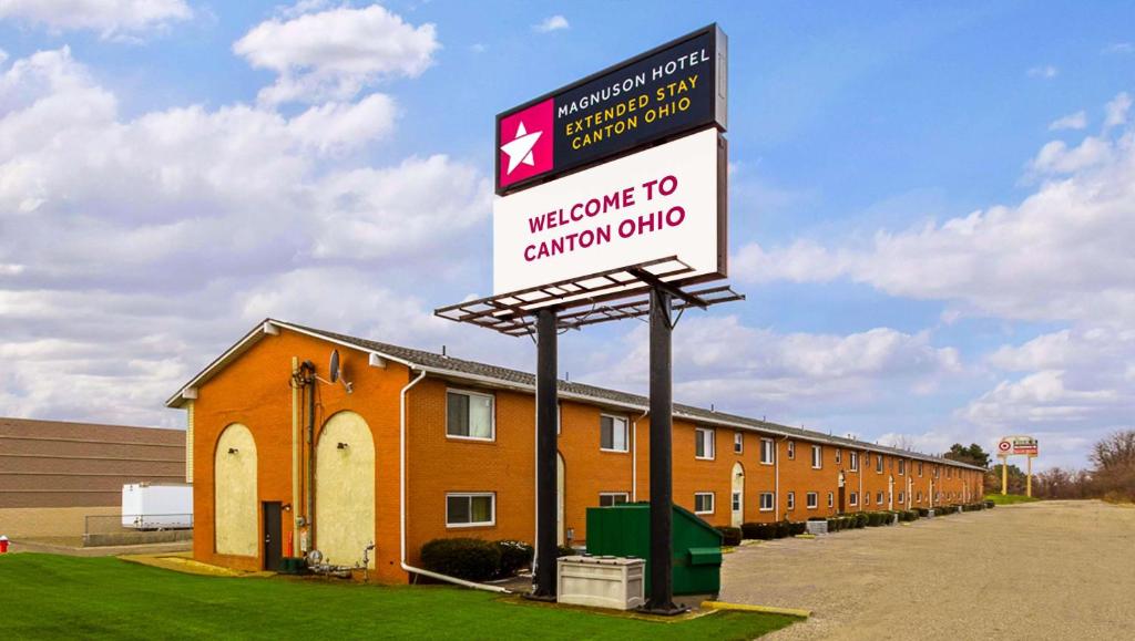 a welcome to canadian club sign in front of a building at Magnuson Hotel Extended Stay Canton Ohio in Lake Cable