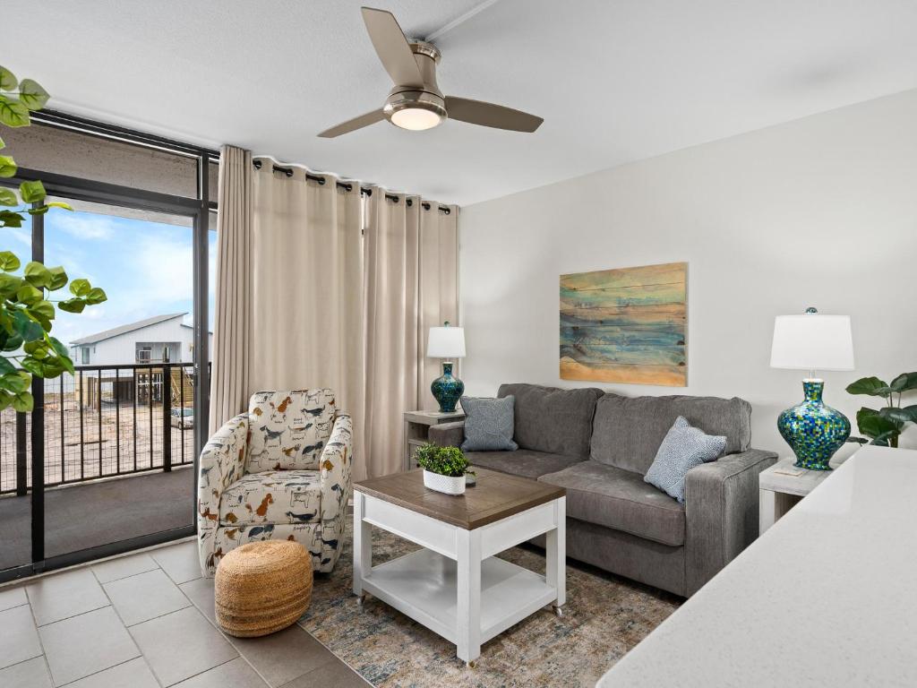 a living room with a couch and a chair at Laguna Reef #311 - Heavenly Hill in Rockport