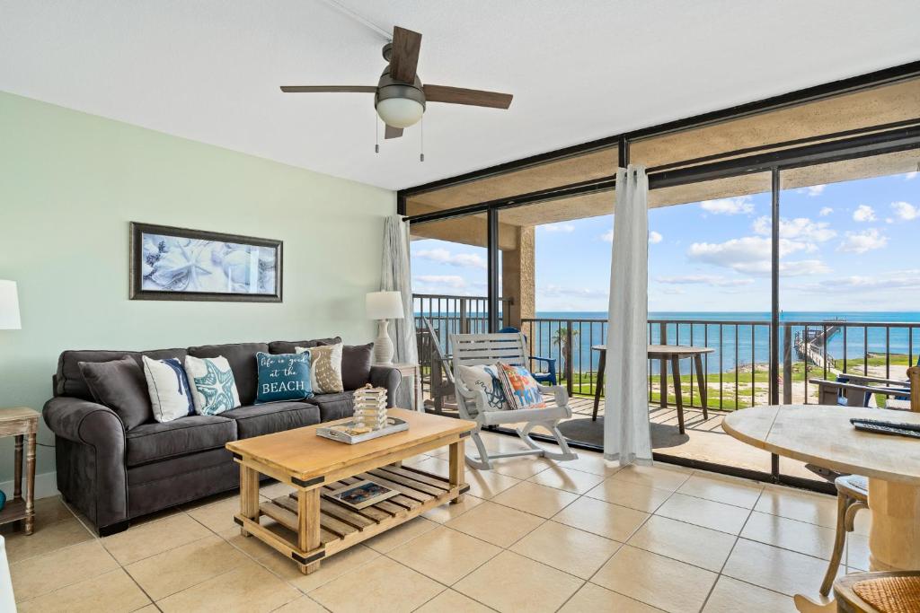 a living room with a couch and a table at Laguna Reef #308 - Beautiful Bay View in Rockport