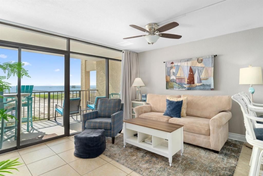 a living room with a couch and a chair at Laguna Reef #213 - Four Point Lighthouse in Rockport