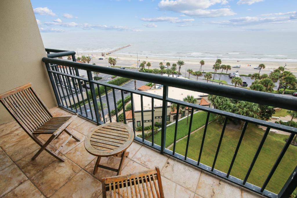 a balcony with chairs and a view of the beach at San Luis 935-Luis Lookout in Galveston