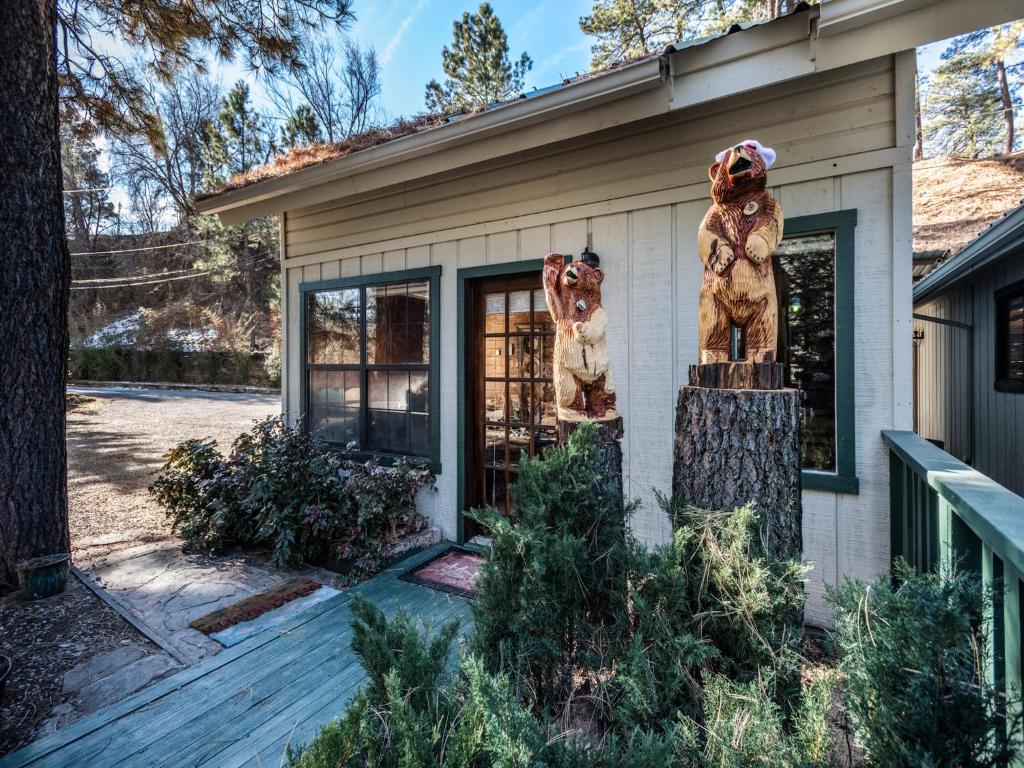 a house with a statue in front of it at Midtown Riverfront 2 in Ruidoso
