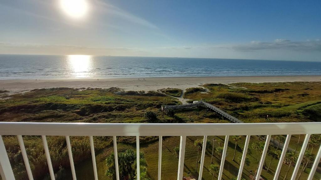 a view of the beach from a balcony at Galvestonian 1002-Beachfront Getaway in Galveston