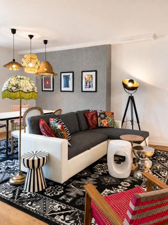 a living room with a couch and a table at CentralStay Tours Centre Gare - Ouverture Aout '26 in Tours