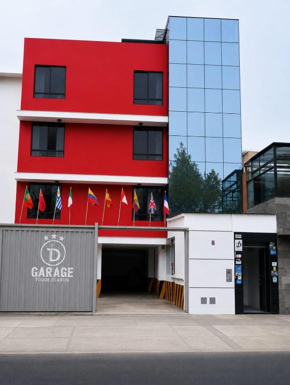 a red and white building with flags on it at DLUXO hotel in Lima