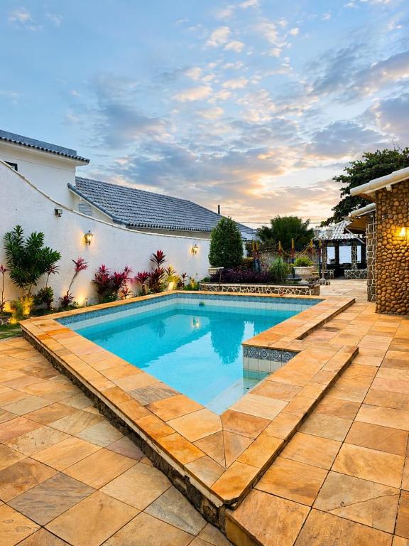 a swimming pool in front of a house at A Tóca in Rio de Janeiro