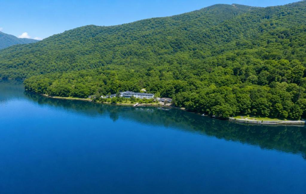 an island in the middle of a large body of water at Sapporo's Secret Onsen Sanctuary Marukoma Onsen Ryokan in Chitose